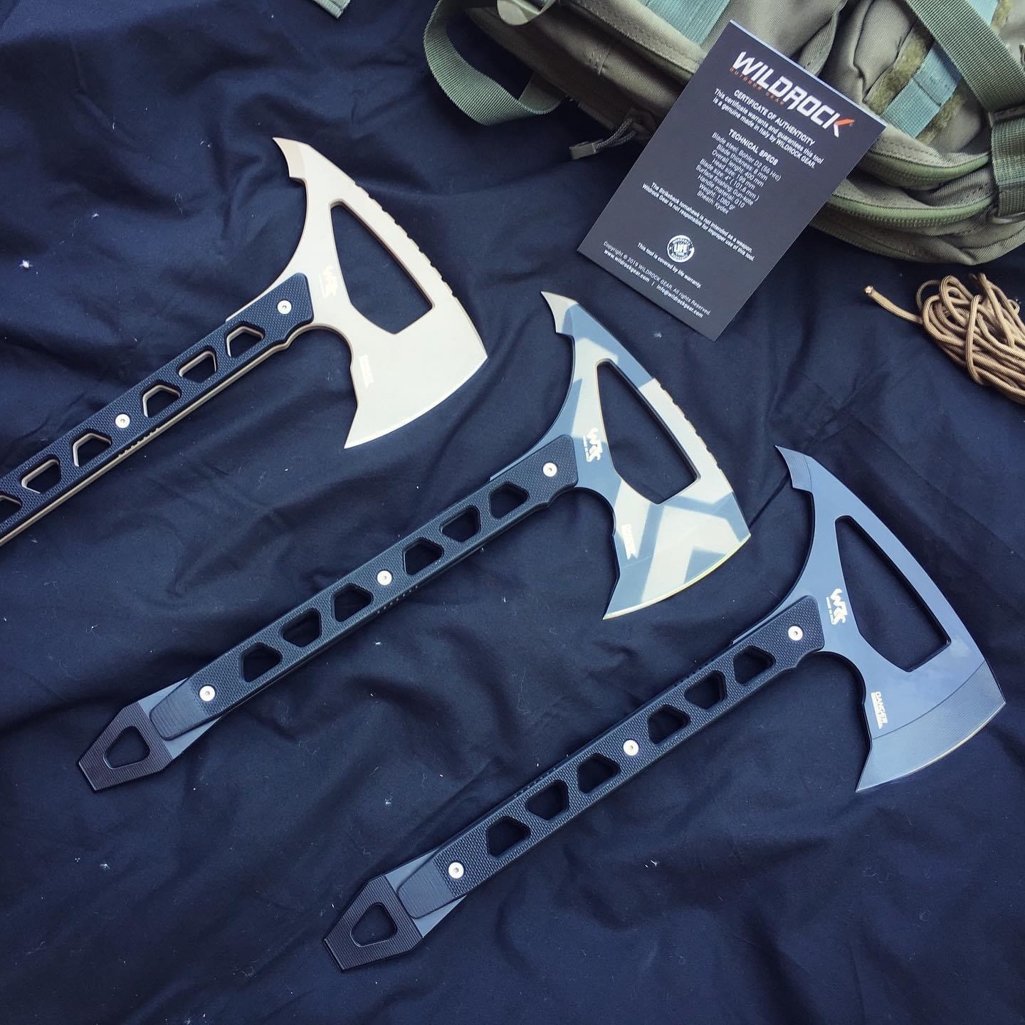 Original WildRock photograph showing the Desert Tan, WR Camo and Full Black Strikeback tomahawks together.